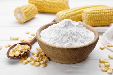 Photo of Bowl with corn starch and kernels on white table