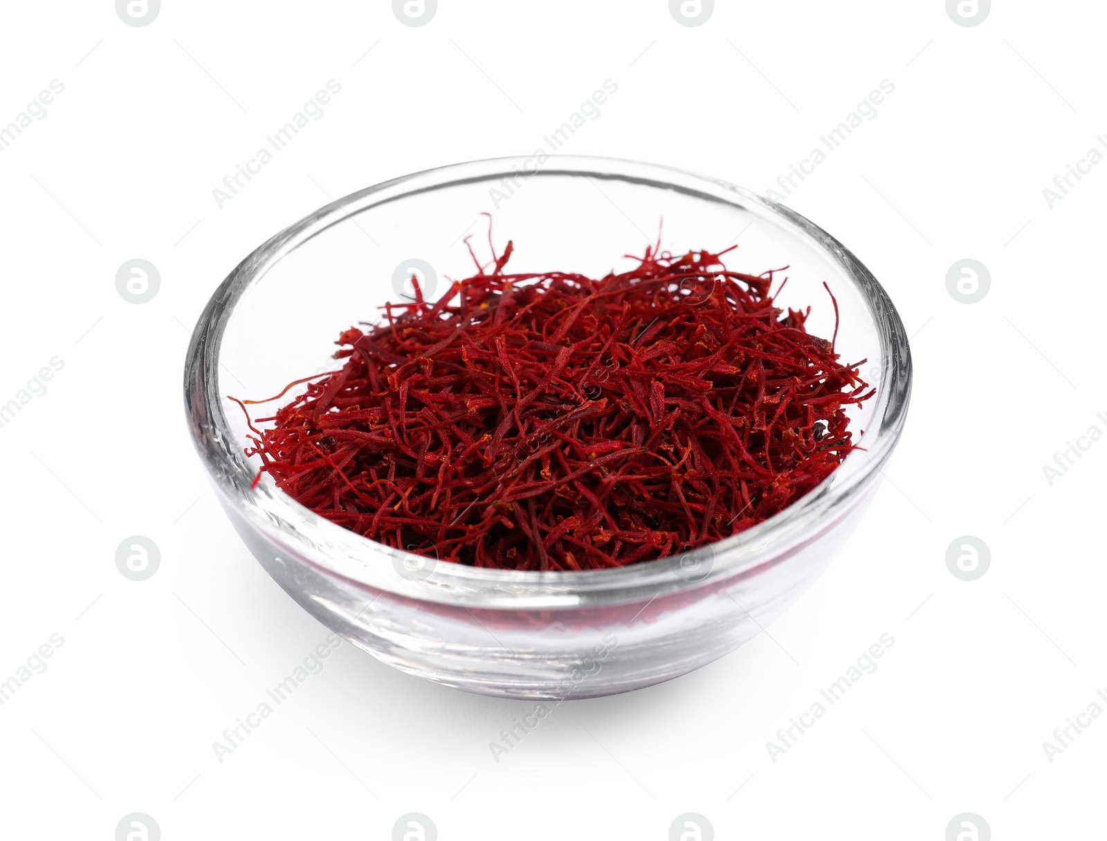 Photo of Aromatic saffron in bowl isolated on white