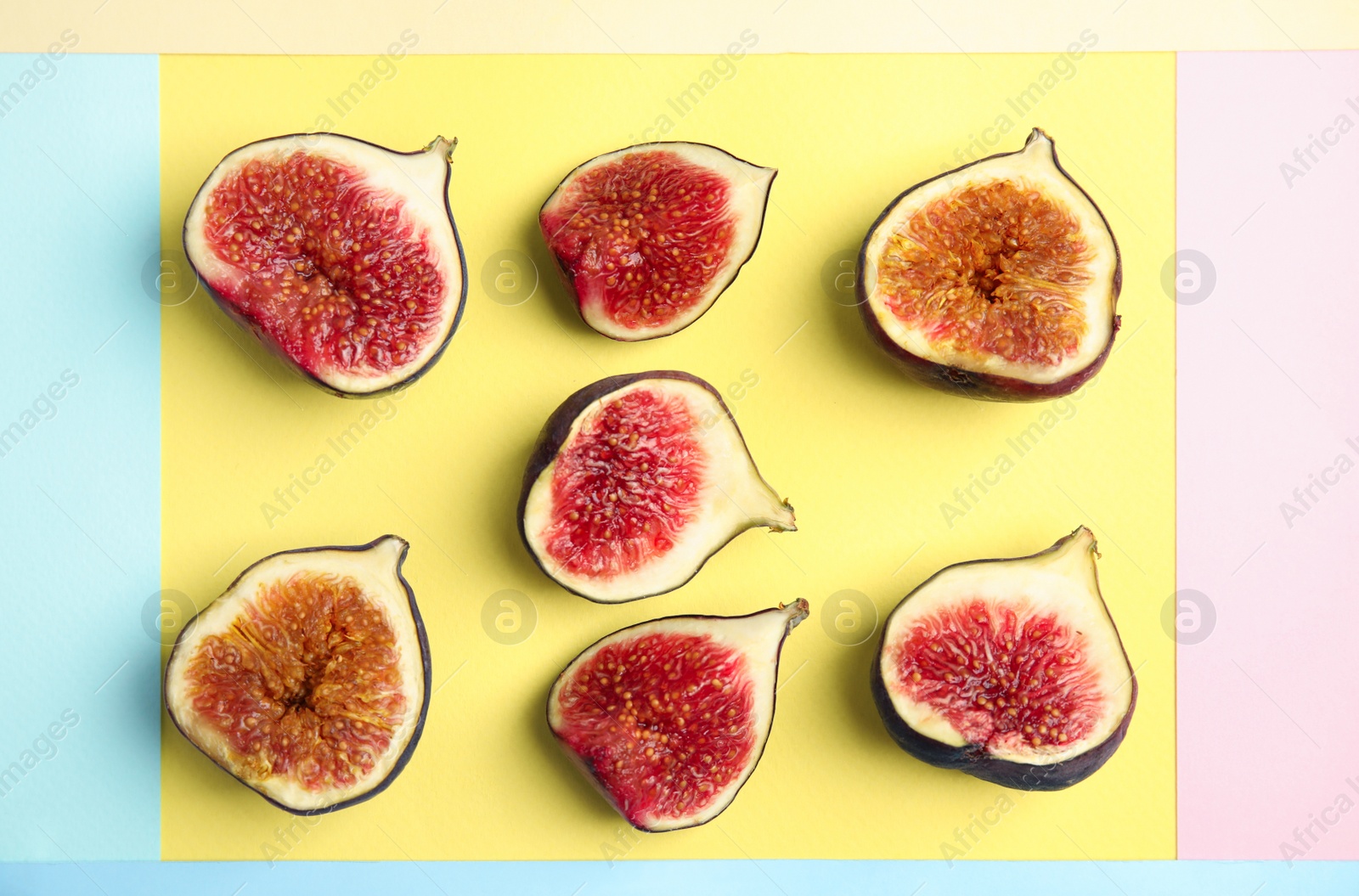 Photo of Delicious ripe figs on color background, flat lay