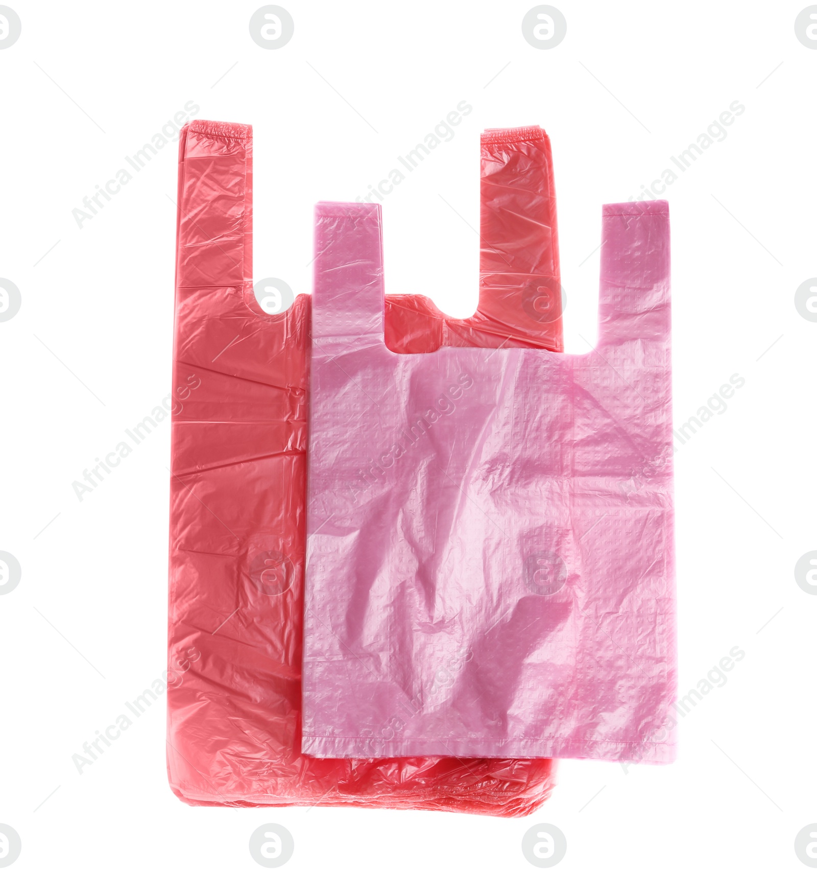 Photo of Stack of plastic bags isolated on white, top view