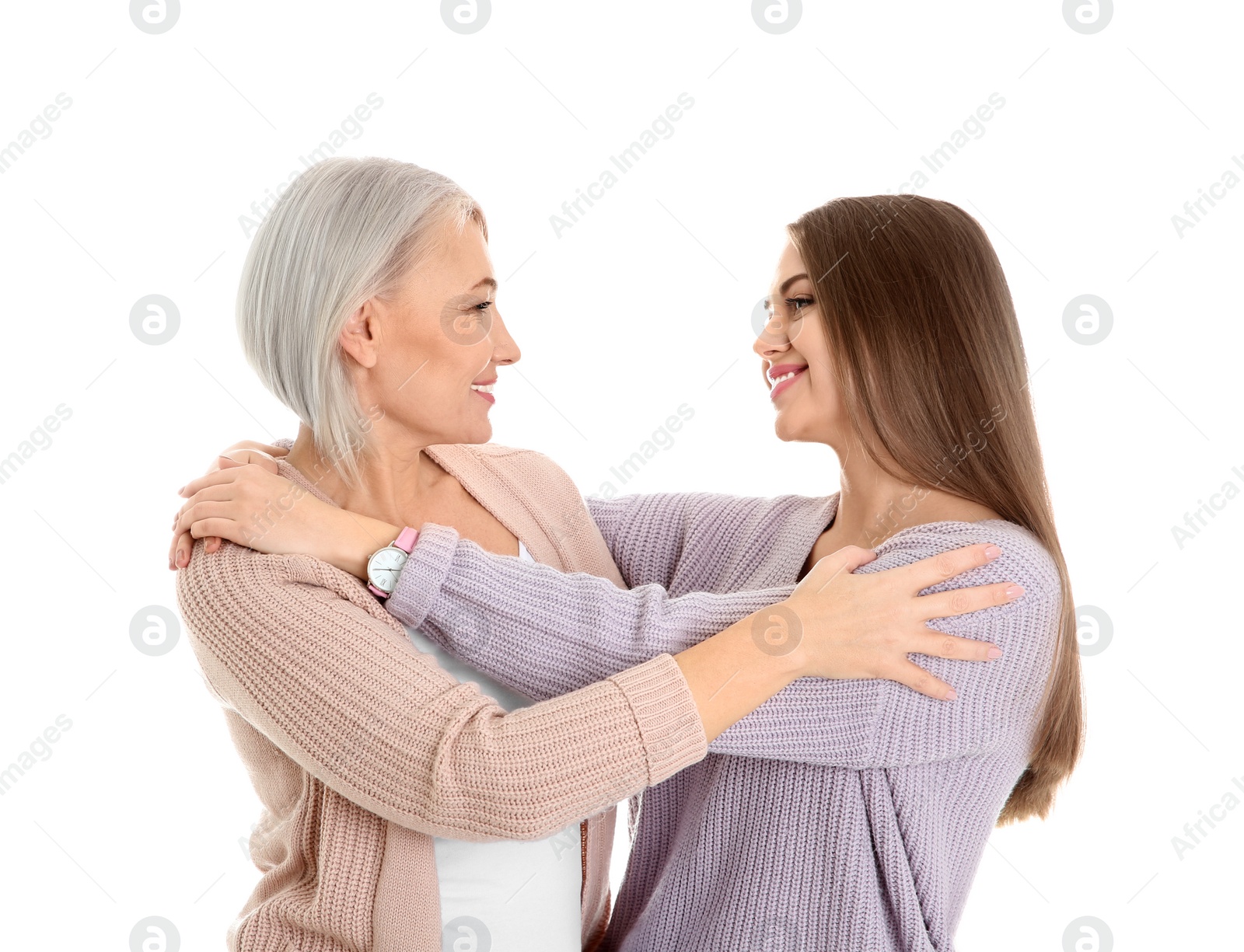 Photo of Portrait of young woman with her mature mother on white background