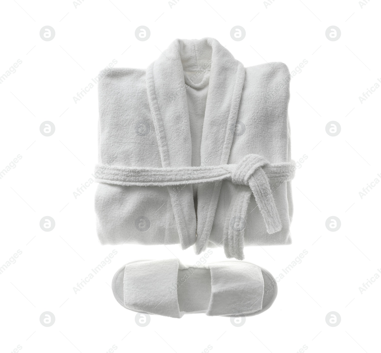 Photo of Clean folded bathrobe and slippers isolated on white, top view