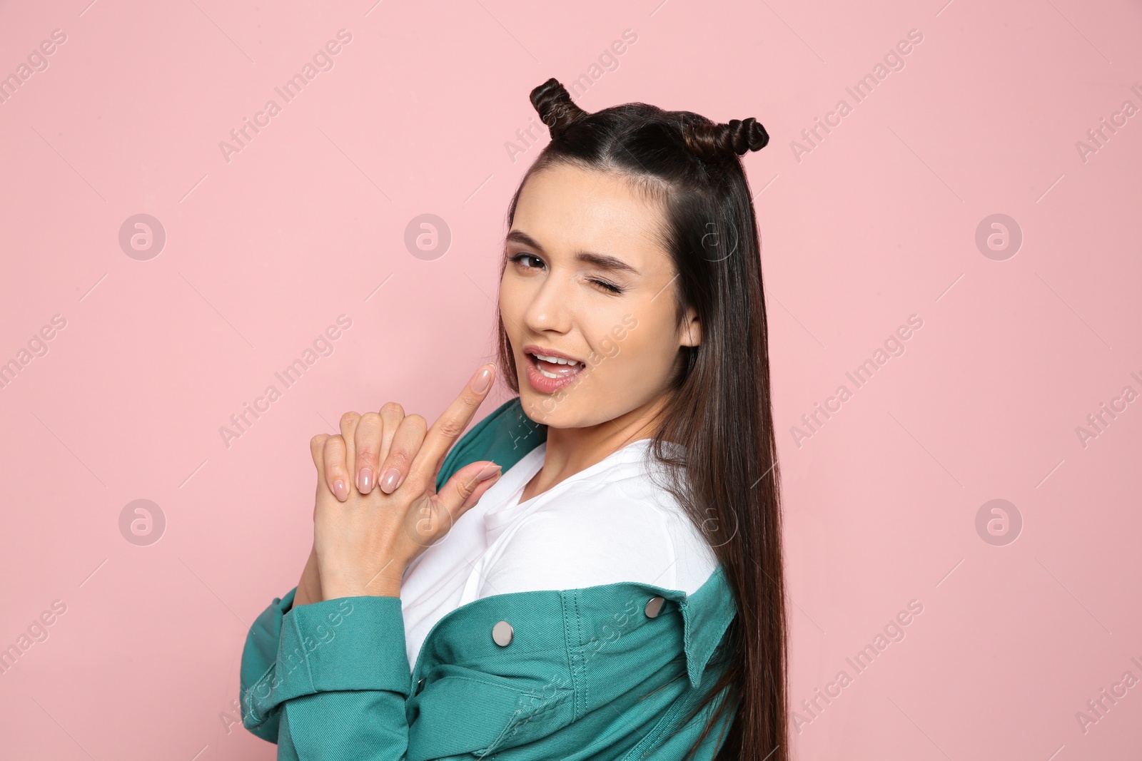 Photo of Portrait of beautiful young woman in stylish clothes on color background