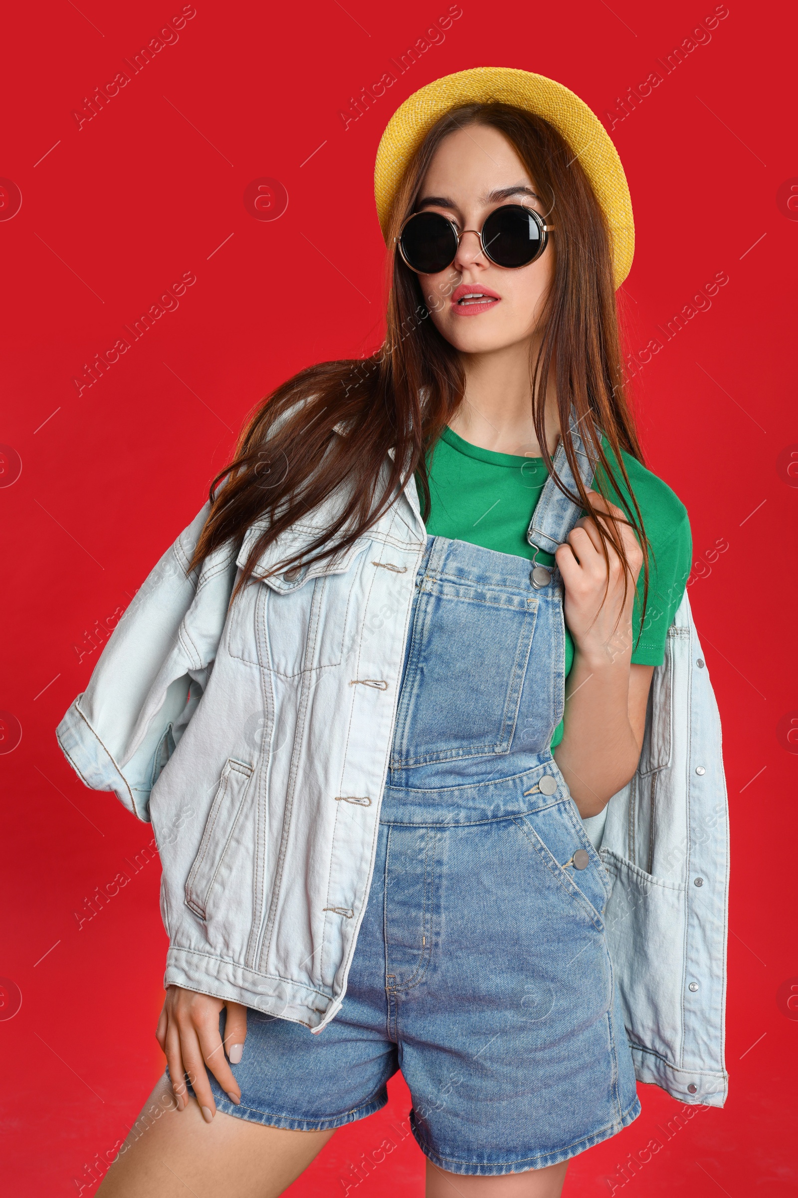 Photo of Portrait of beautiful woman on red background