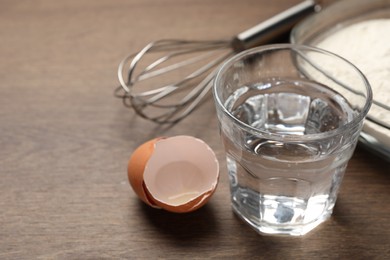 Photo of Cooking scones with soda water. Ingredients for dough on wooden table, closeup