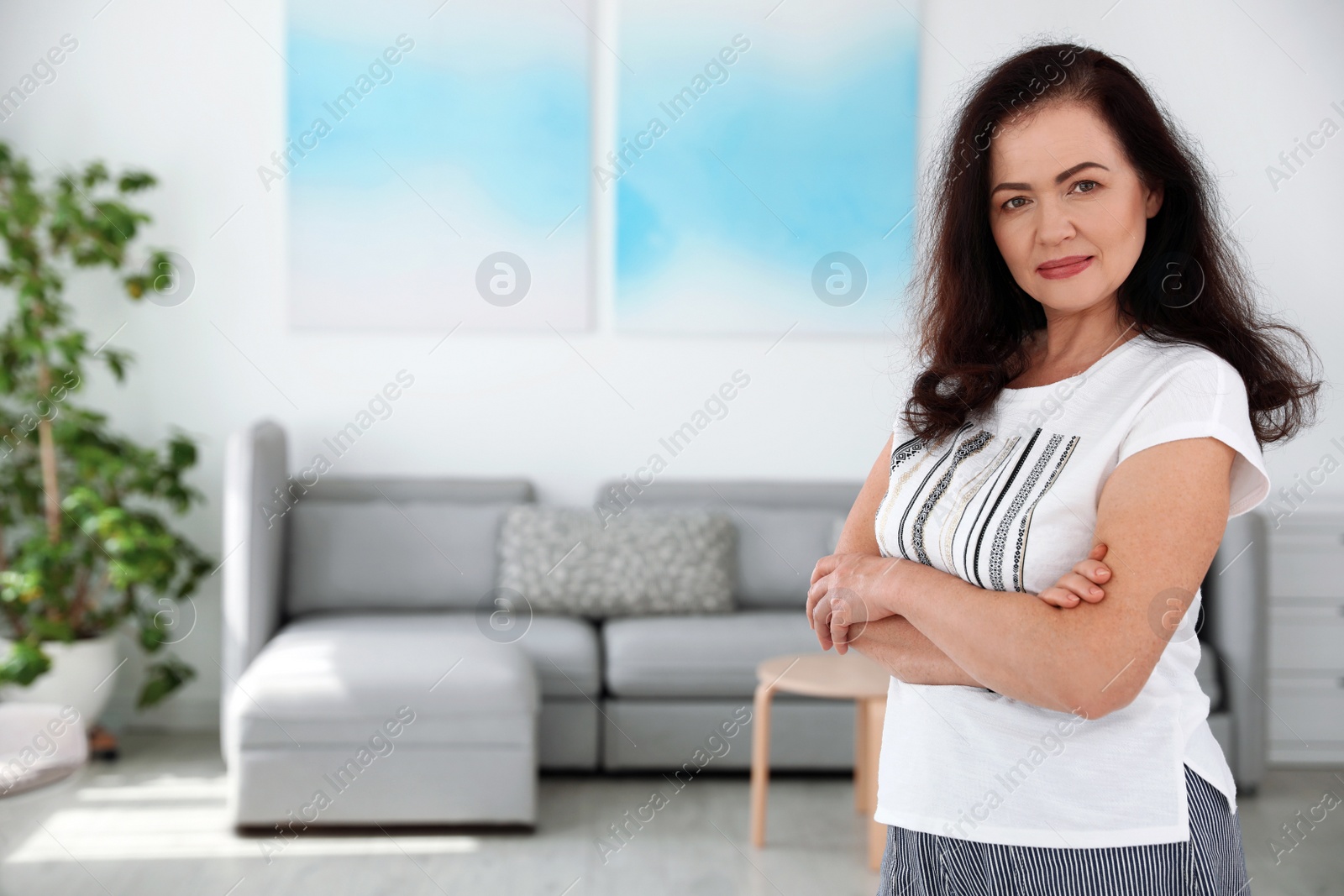 Photo of Portrait of mature woman with beautiful face indoors. Space for text