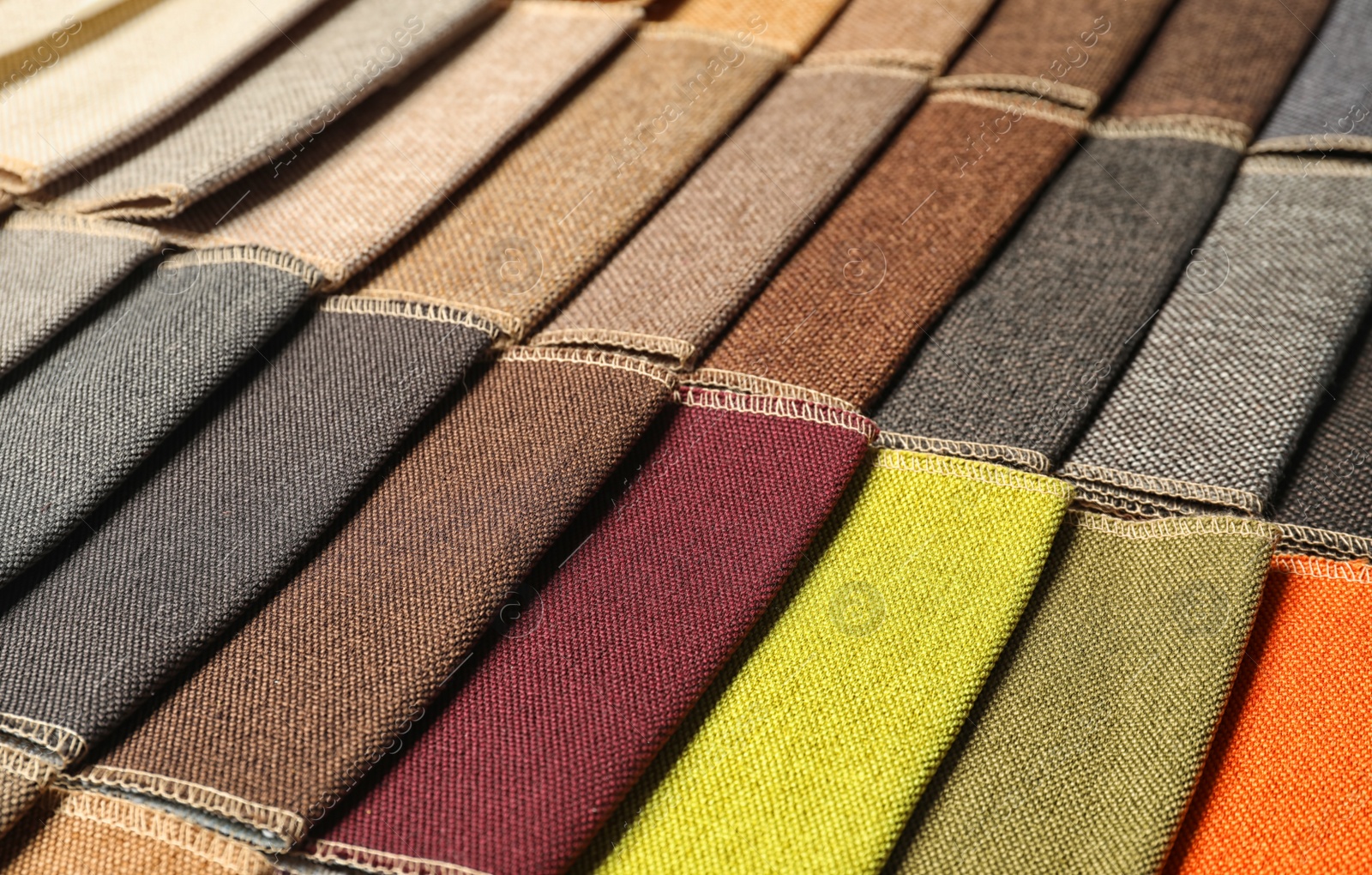 Photo of Fabric samples of different colors for interior design as background