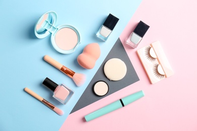 Flat lay composition with cosmetic products on color background