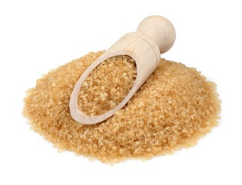 Photo of Pile of brown sugar and scoop isolated on white