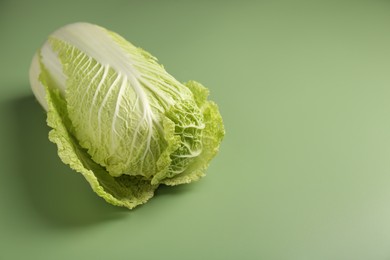 Photo of Fresh ripe Chinese cabbage on pale green background. Space for text