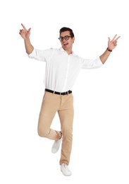 Photo of Handsome young man with glasses dancing on white background