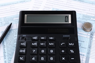 Photo of Tax accounting. Calculator, documents, pen and coins, closeup