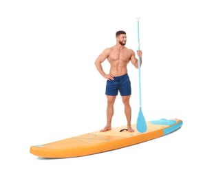 Happy man with paddle on orange SUP board against white background
