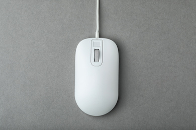Photo of Modern wired computer mouse on grey background, top view