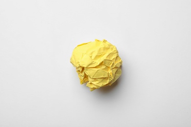 Colorful crumpled sheet of paper on white background, top view