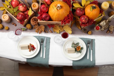 Beautiful autumn place setting and decor on table, flat lay