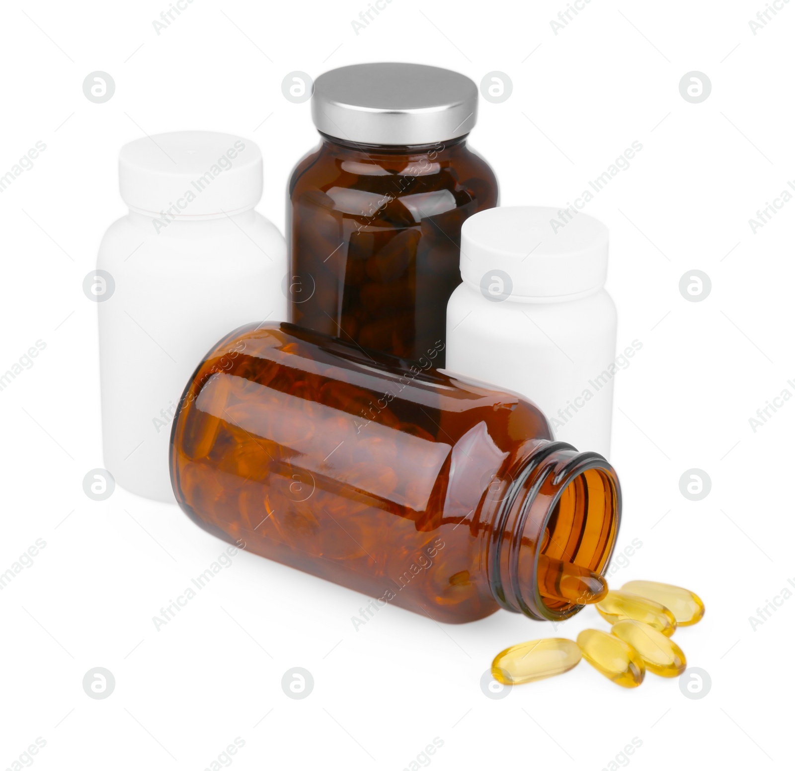 Photo of Vitamin capsules and medical bottles isolated on white