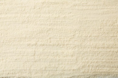 Photo of Texture of baking powder as background, top view