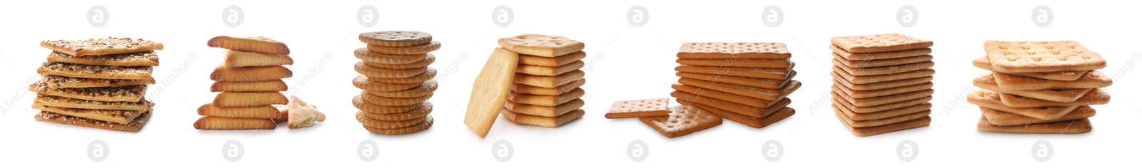 Image of Set of different tasty stacked crackers on white background, banner design