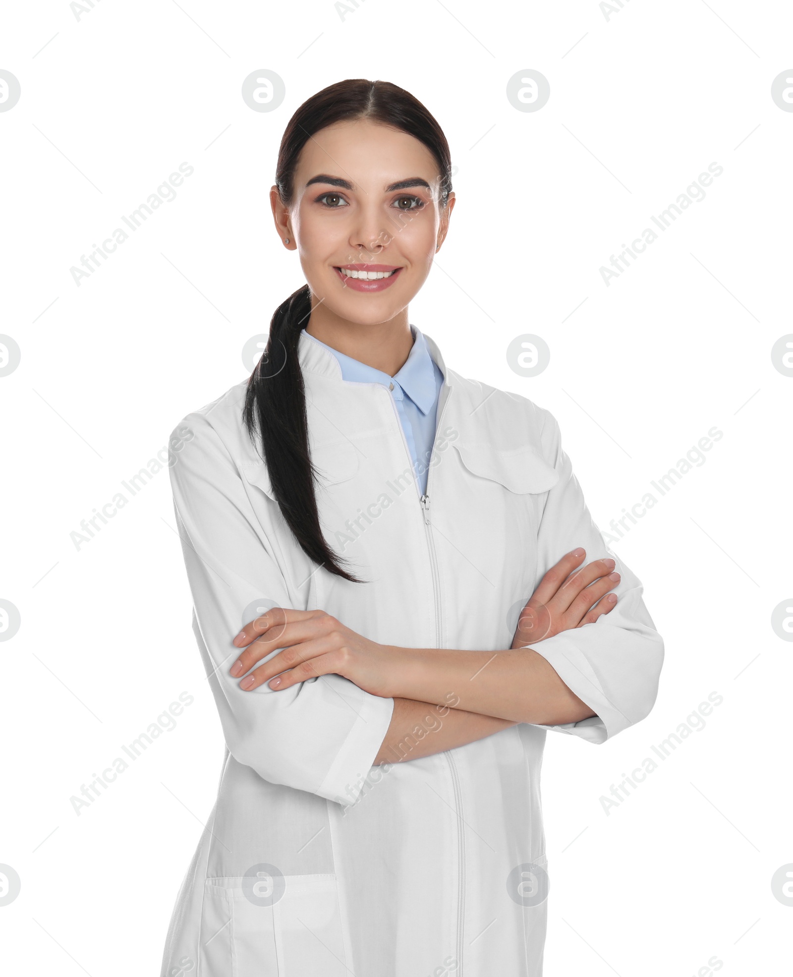 Photo of Happy young woman in lab coat on white background