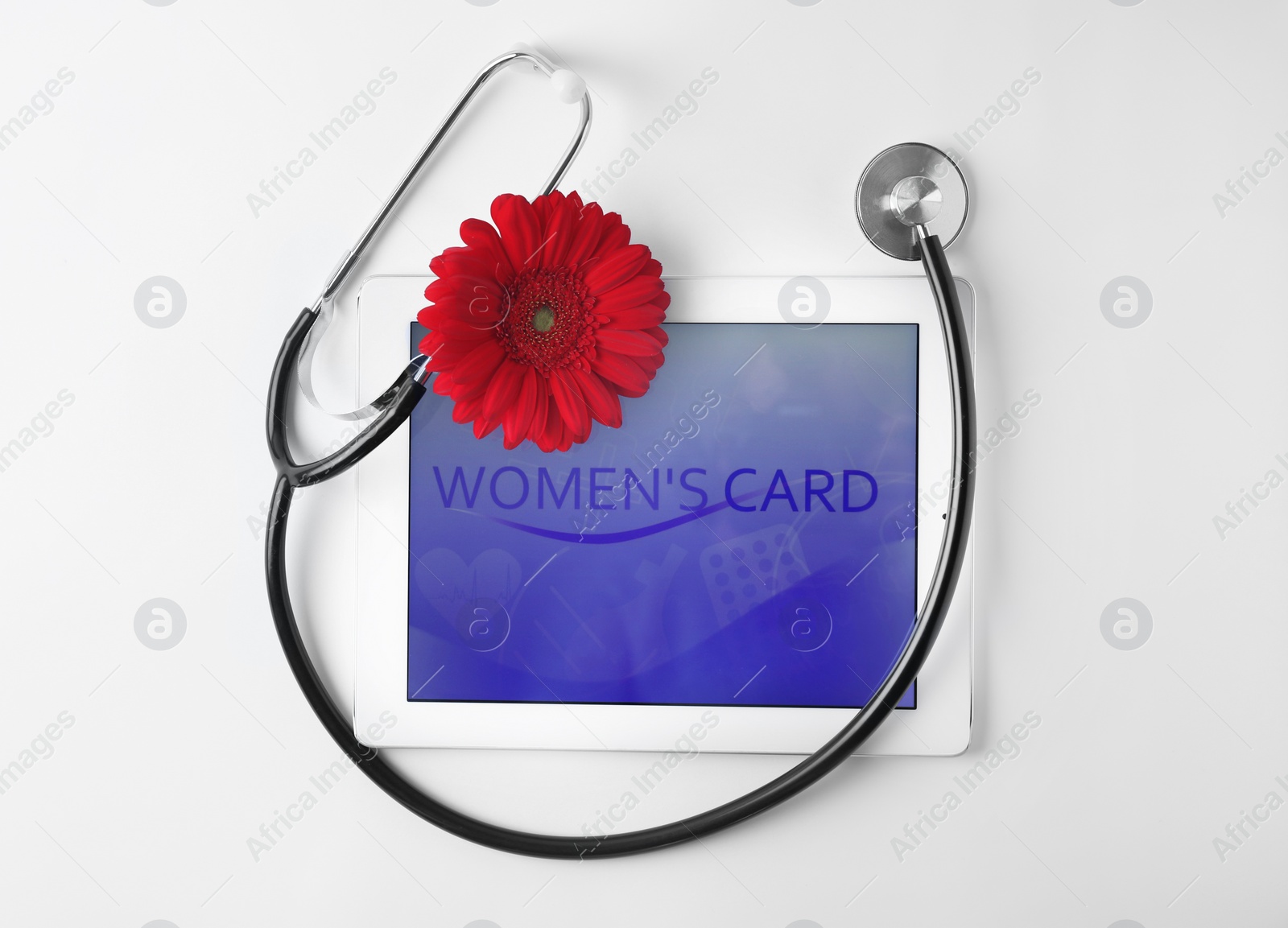 Photo of Tablet and stethoscope on white background, top view. Gynecology concept