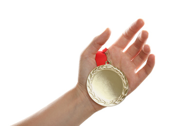 Photo of Woman holding golden medal on white background, closeup. Space for design