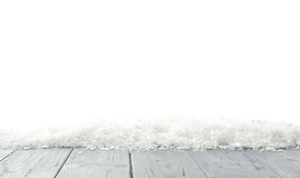 Snow on grey wooden surface against white background. Christmas season