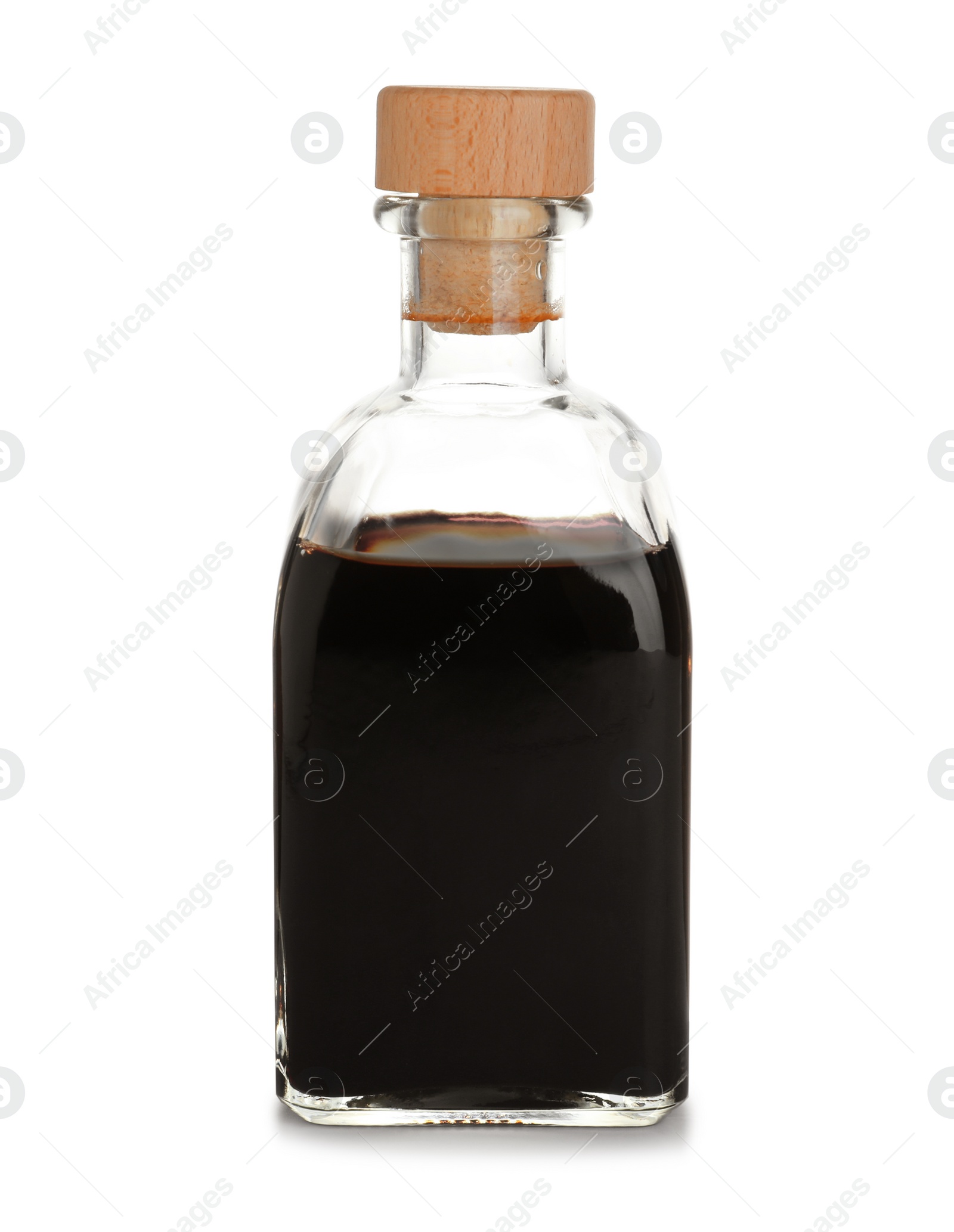 Photo of Bottle with balsamic vinegar on white background