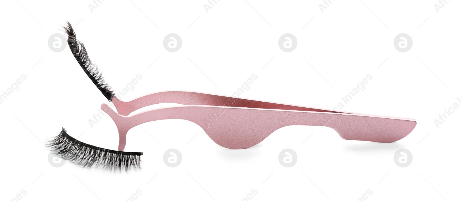 Photo of Magnetic eyelashes and tweezers on white background