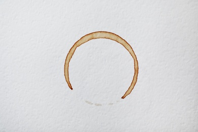 Photo of Dried coffee cup stain on white background, top view