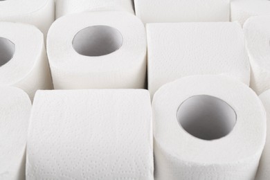 Photo of Many soft toilet paper rolls as background, closeup