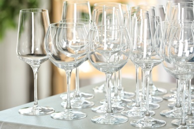 Set of empty glasses on grey table