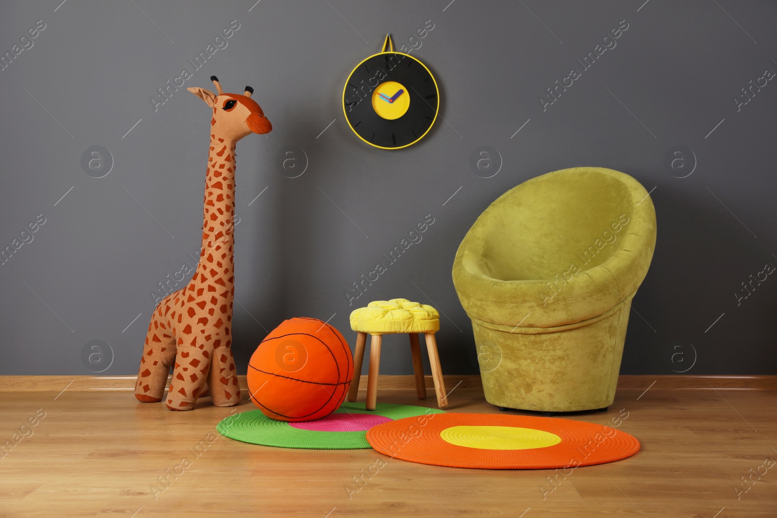 Photo of Child's room interior with comfortable armchair and toys