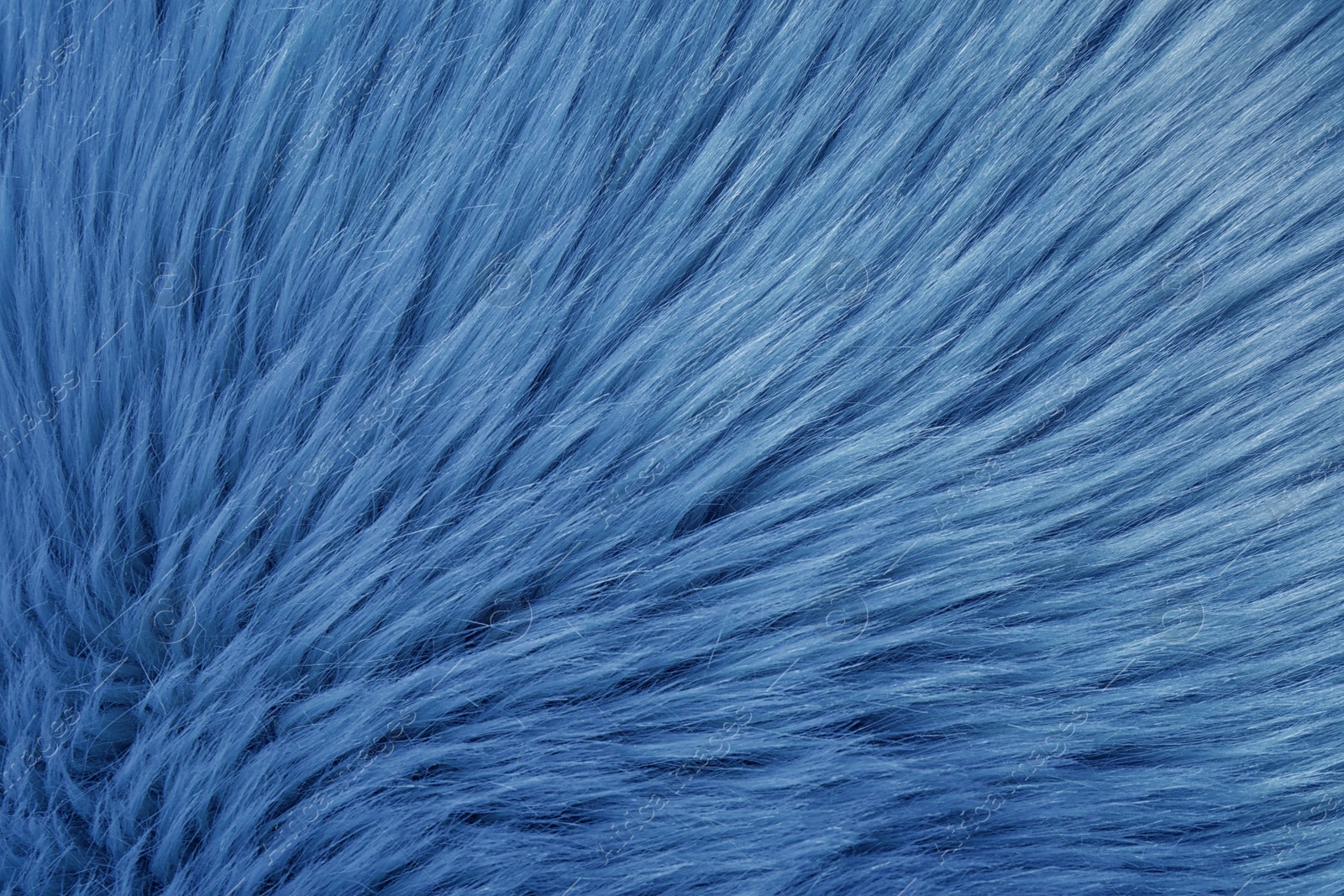 Photo of Faux fur as background, top view. Color of the year 2020 (Classic blue)