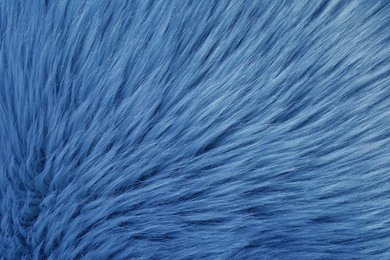 Photo of Faux fur as background, top view. Color of the year 2020 (Classic blue)