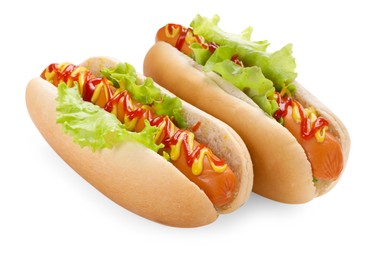 Tasty hot dogs with lettuce, ketchup and mustard isolated on white