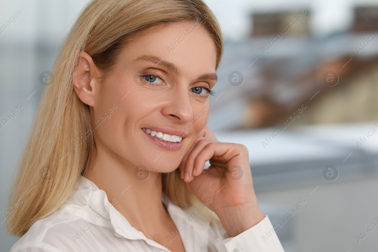 Photo of Portrait of confident entrepreneur or businesswoman, space for text. Beautiful lady with blonde hair smiling and looking into camera