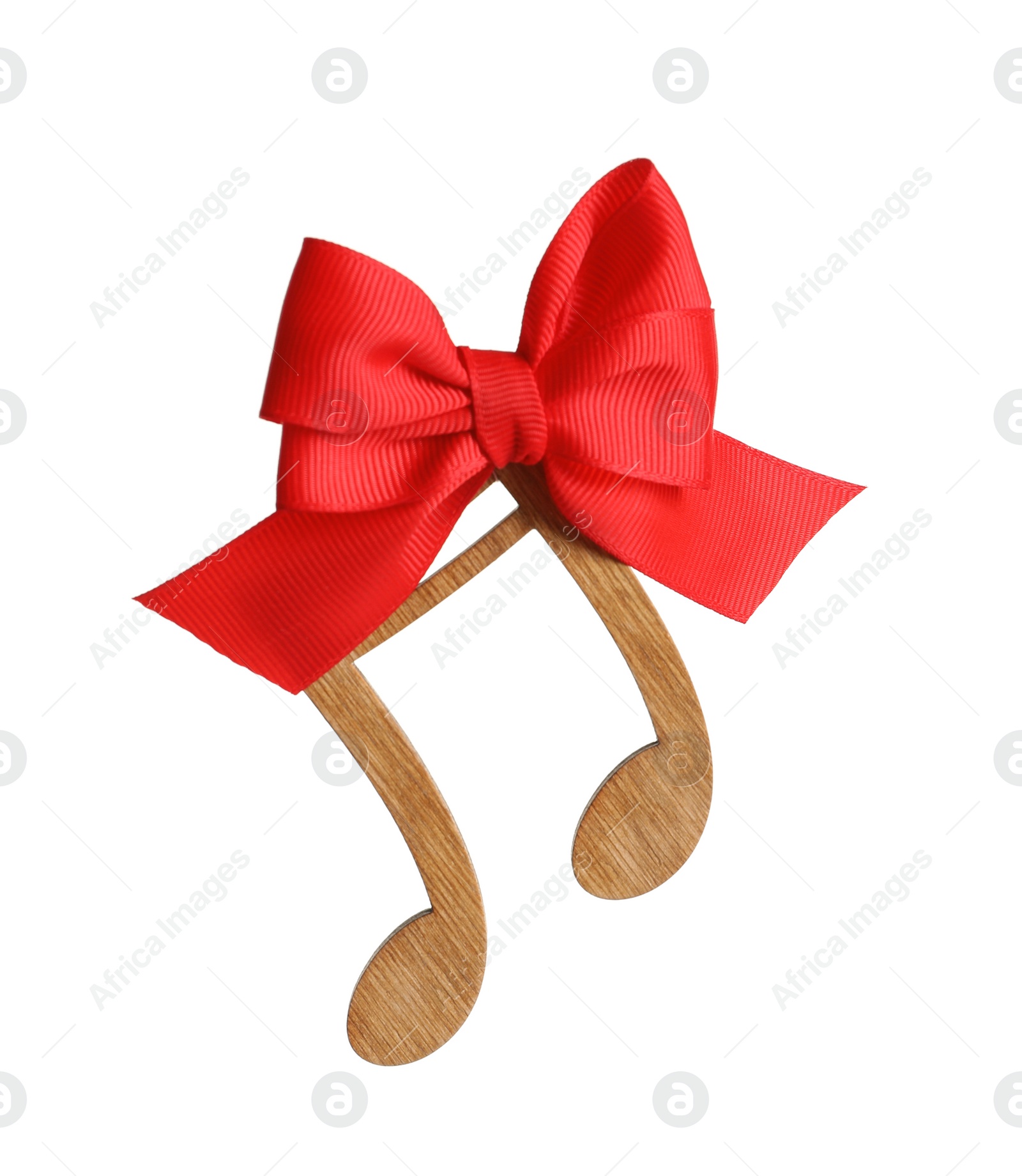 Photo of Wooden note with bow on white background. Christmas music concept