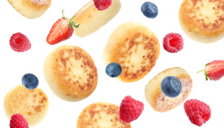 Image of Delicious cottage cheese pancakes and berries falling on white background