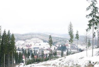 Beautiful view of small town in snowy valley. Winter vacation