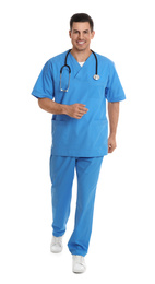 Doctor in uniform walking on white background