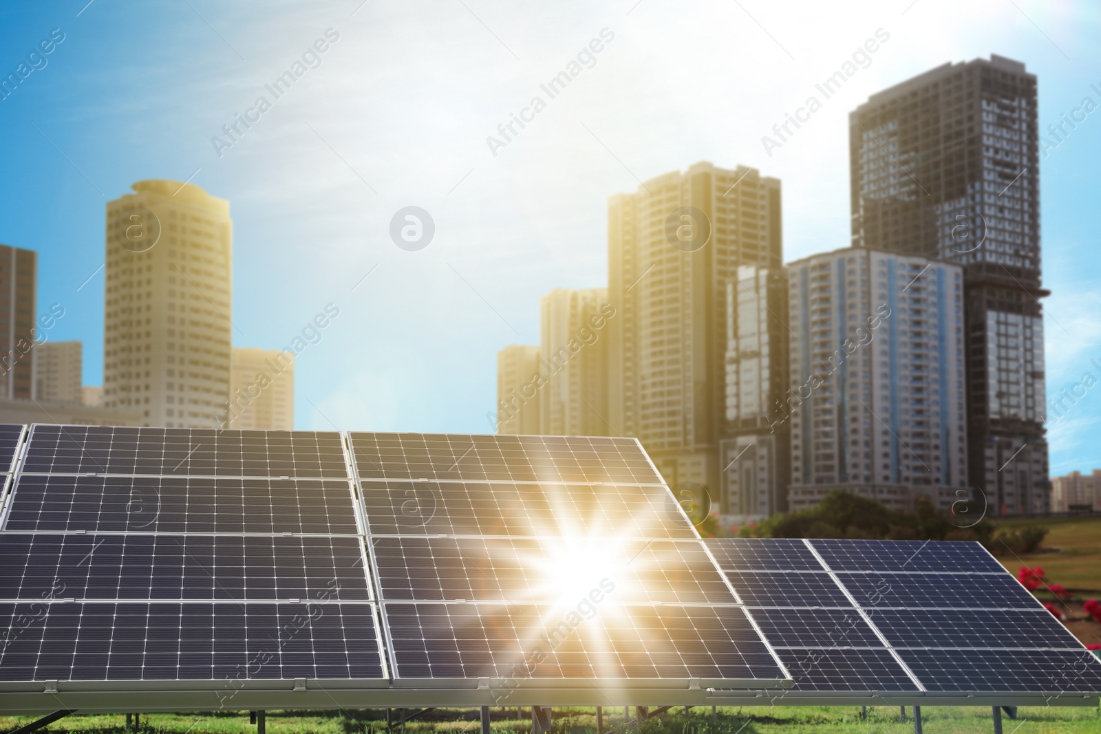 Image of Cityscape and solar panels installed outdoors. Alternative energy source