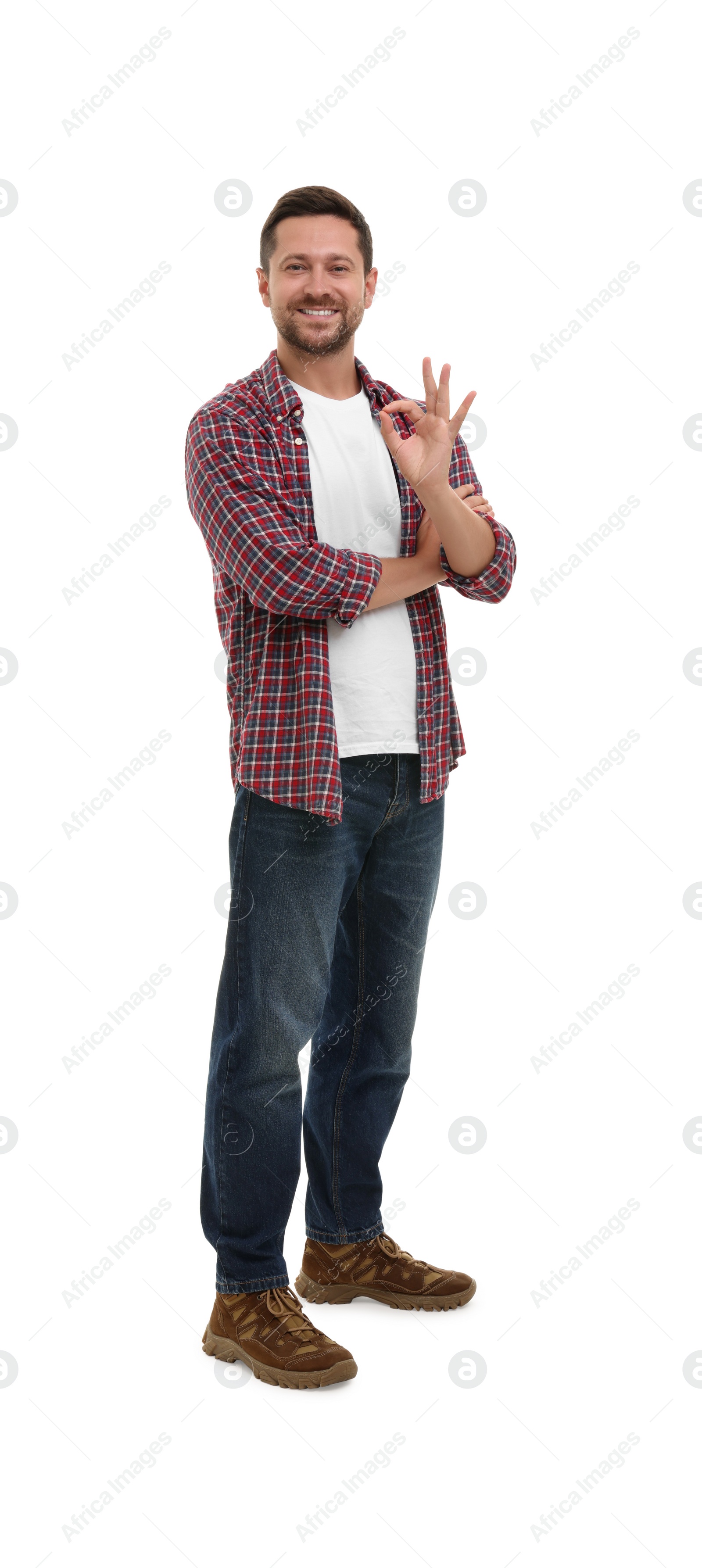 Photo of Happy man showing ok gesture on white background