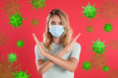 Image of Stop Covid-19 outbreak. Woman wearing medical mask surrounded by virus on red background