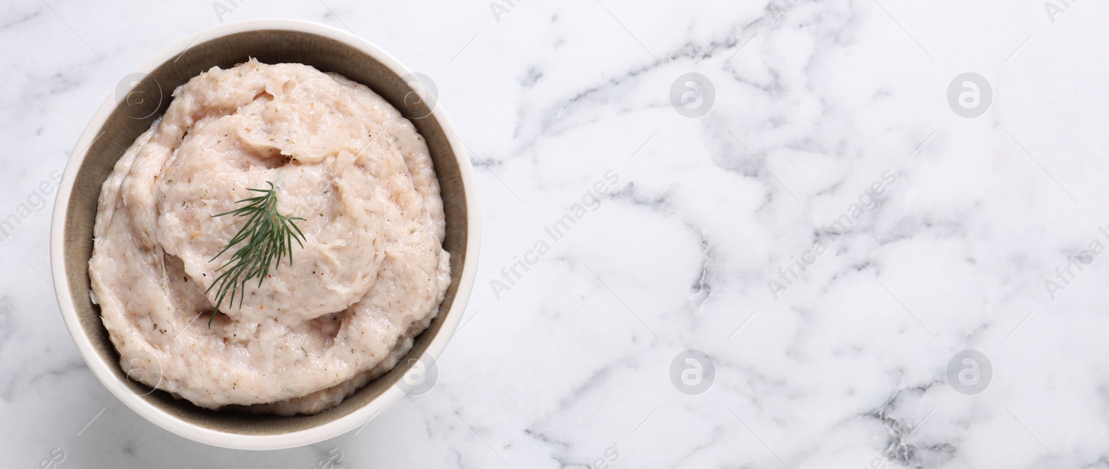 Photo of Delicious lard spread on white marble table, top view. Space for text