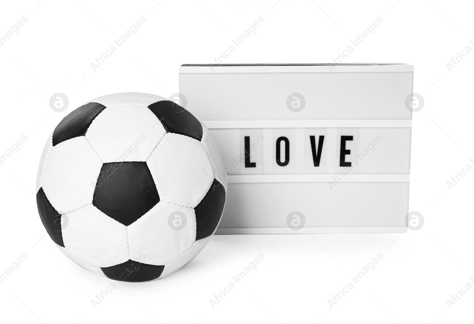 Photo of Soccer ball and lightbox with word Love on white background