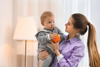 Teen nanny with cute little baby at home