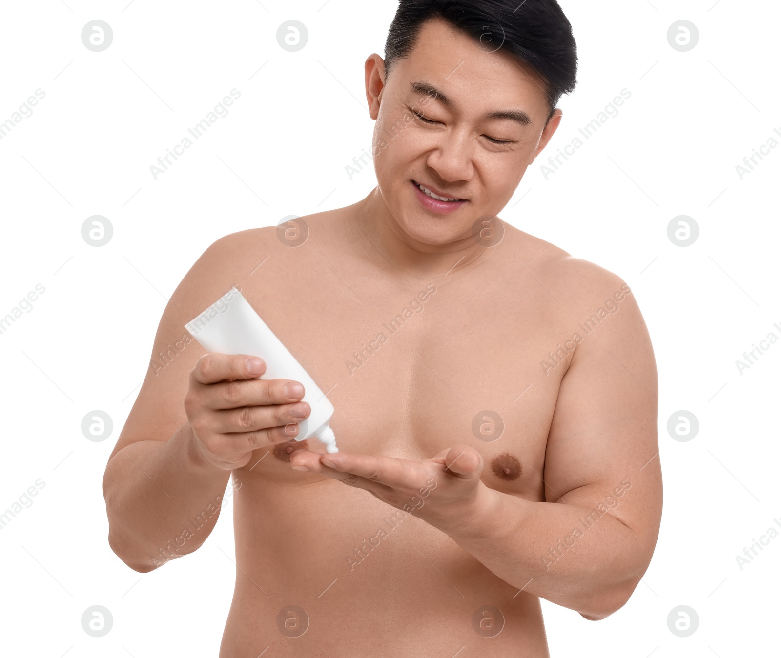 Photo of Handsome man applying body cream onto his hand on white background