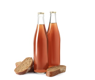 Photo of Bottles of delicious fresh kvass and bread isolated on white