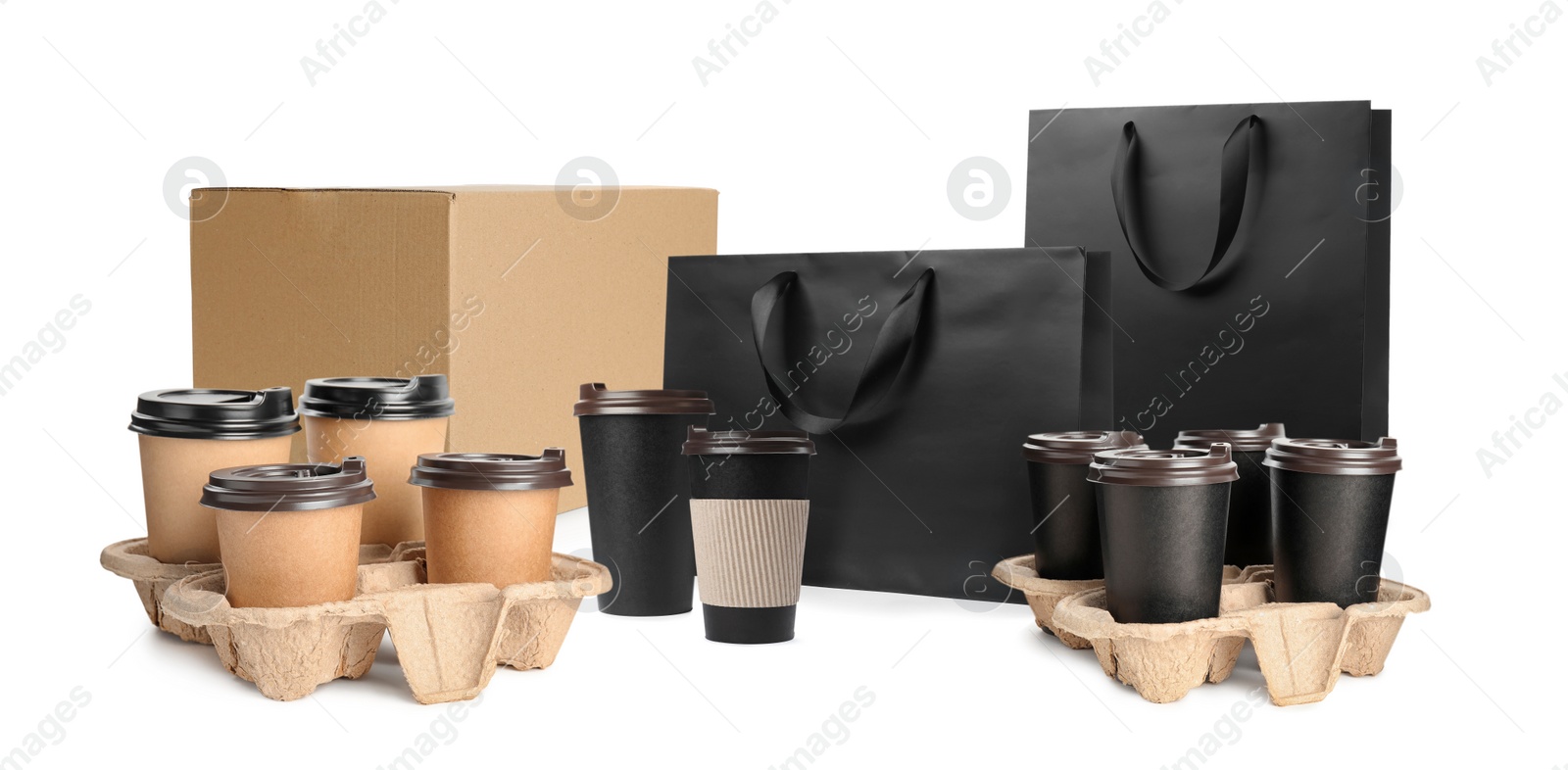 Image of Set with cardboard box, takeaway cups and paper bags on white background